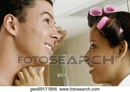 Low angle view of a young man and a teenage girl View Large Photo Image Stock Photograph - Low angle view of a young man and a teenage girl. Fotosearch