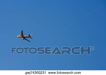 Low angle view of an airplane flying in the sky View Large Photo Image Stock Image - Low angle view of an airplane flying in the sky. Fotosearch