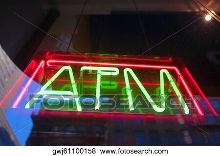 Low angle view of an ATM neon sign View Large Photo Image Stock Photo - Low angle view of an ATM neon sign. Fotosearch