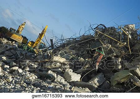 Low angle view of earth movers at a construction site View Large Photo Image Stock Image - Low angle view of earth movers at a construction site. Fotosearch