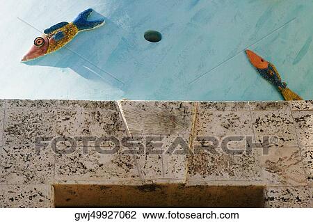 Low angle view of fish engraved on the wall View Large Photo Image Stock Image - Low angle view of fish engraved on the wall. Fotosearch
