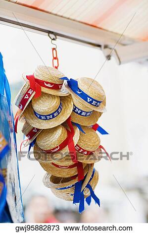 Low angle view of hats hanging at a market stall View Large Photo Image Stock Image - Low angle view of hats hanging at a market stall. Fotosearch