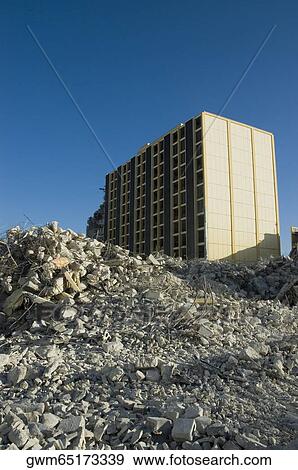 Stock Photo - Low angle view of rubble in front of a building. Fotosearch