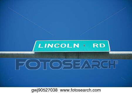Low angle view of street name sign View Large Photo Image Stock Photo - Low angle view of street name sign. Fotosearch