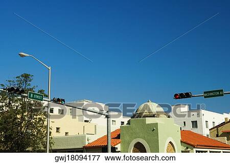 Low angle view of traffic lights in a city, Miami, Florida, USA View Large Photo Image Stock Photo - Low angle view of traffic lights in a city, Miami, Florida, USA. Fotosearch