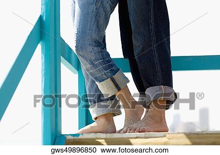 Low section view of a man and a woman standing on a lifeguard hut View Large Photo Image Stock Image - Low section view of a man and a woman standing on a lifeguard hut. Fotosearch