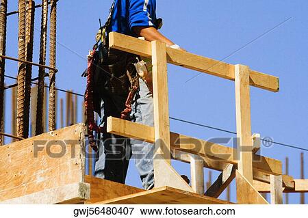 Low section view of a worker at a construction site, Miami, Florida, USA View Large Photo Image Stock Photo - Low section view of a worker at a construction site, Miami, Florida, USA. Fotosearch