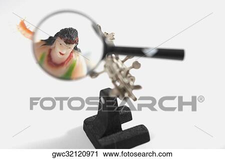Magnifying glass on a Chinese idol View Large Photo Image Stock Image - Magnifying glass on a Chinese idol. Fotosearch