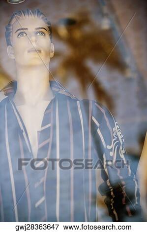 Male mannequin behind a glass window View Large Photo Image Stock Photo - Male mannequin behind a glass window. Fotosearch