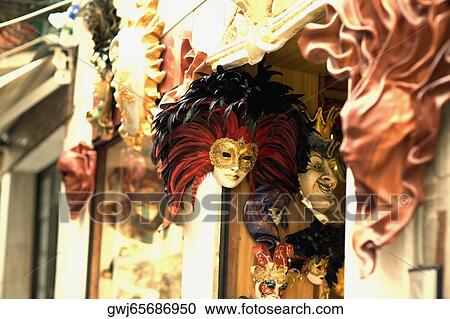 Masks hanging at the entrance of a store View Large Photo Image Stock Image - Masks hanging at the entrance of a store. Fotosearch