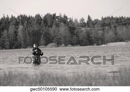 Mature man fishing in the river View Large Photo Image Stock Image - Mature man fishing in the river. Fotosearch