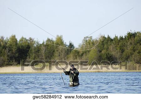 Mature man fishing in the river View Large Photo Image Stock Image - Mature man fishing in the river. Fotosearch