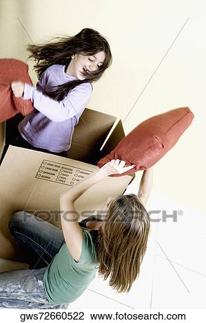 Mid adult woman playing with her daughter View Large Photo Image Stock Image - Mid adult woman playing with her daughter. Fotosearch