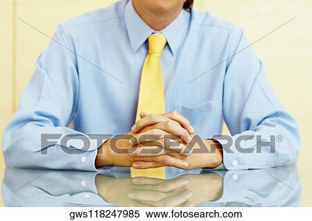 Mid section view of a businessman View Large Photo Image Stock Photography - Mid section view of a businessman. Fotosearch
