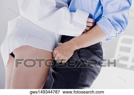 Mid section view of a man and woman standing View Large Photo Image Stock Photo - Mid section view of a man and woman standing. Fotosearch