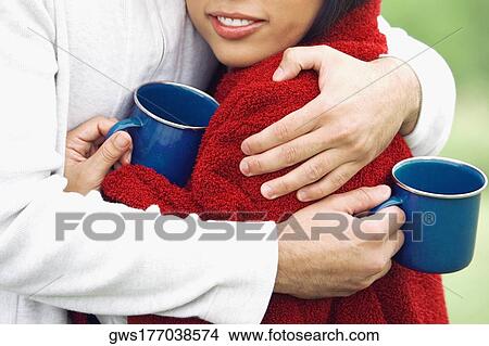 Mid section view of a man embracing a woman View Large Photo Image Picture - Mid section view of a man embracing a woman. Fotosearch