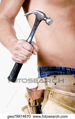 Mid section view of a man holding a claw hammer View Large Photo Image Stock Image - Mid section view of a man holding a claw hammer. Fotosearch