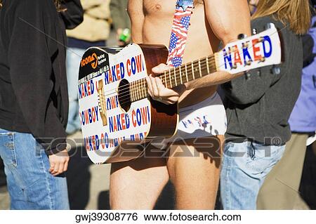 Mid section view of a man playing the guitar View Large Photo Image Stock Photograph - Mid section view of a man playing the guitar. Fotosearch