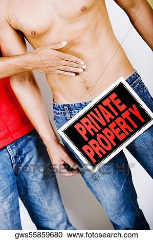 Mid section view of a man with a Private Property sign on his crotch standing beside another man View Large Photo Image Stock Image - Mid section view of a man with a Private Property sign on his crotch standing beside another man. Fotosearch