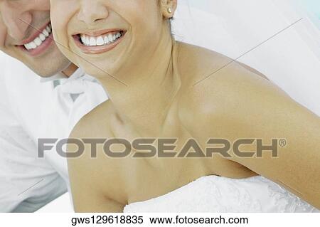 Mid section view of a mid adult couple View Large Photo Image Stock Photography - Mid section view of a mid adult couple. Fotosearch
