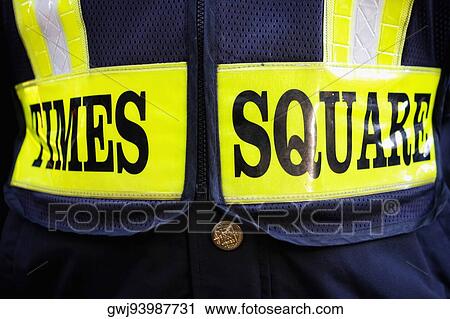 Stock Image - Mid section view of a person wearing a uniform, Times Square, Manhattan, New York City, New York State, USA. Fotosearch