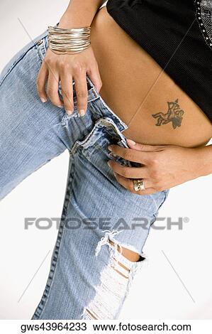 Mid section view of a woman View Large Photo Image Stock Image - Mid section view of a woman. Fotosearch