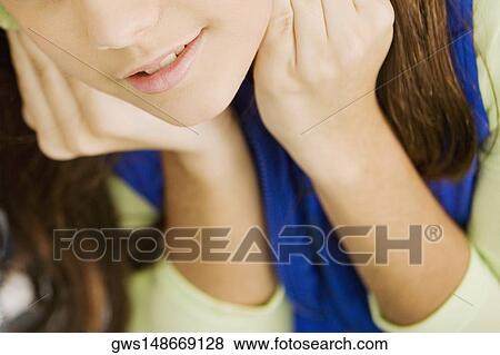 Mid section view of a woman View Large Photo Image Stock Photo - Mid section view of a woman. Fotosearch