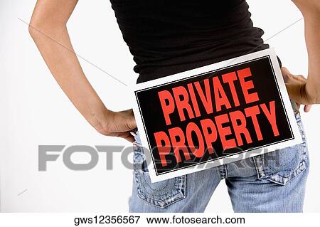 Mid section view of a woman with a Private Property sign sticking behind her View Large Photo Image Stock Photo - Mid section view of a woman with a Private Property sign sticking behind her. Fotosearch