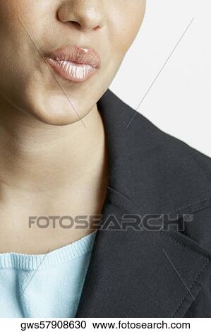 Mid section view of a young woman puckering her lips View Large Photo Image Stock Image - Mid section view of a young woman puckering her lips. Fotosearch