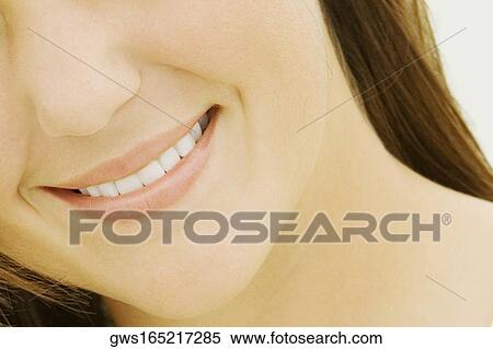 Mid section view of a young woman View Large Photo Image Stock Photography - Mid section view of a young woman. Fotosearch