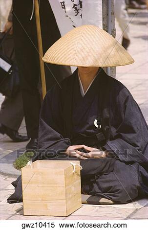 Stock Photography - Monk begging at the sidewalk, Tokyo Prefecture, Japan. Fotosearch