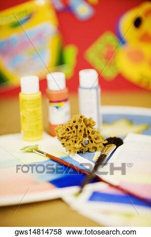 Paint brushes with sponge and color bottles View Large Photo Image Stock Photo - Paint brushes with sponge and color bottles. Fotosearch