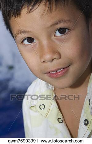 Stock Image - Portrait of a boy grinning. Fotosearch