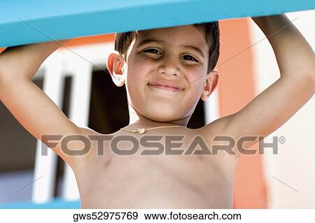 Stock Photo - Portrait of a boy grinning. Fotosearch
