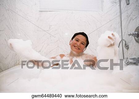 Portrait of a boy in a bubble bath View Large Photo Image Stock Image - Portrait of a boy in a bubble bath. Fotosearch