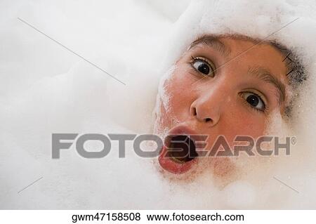 Portrait of a boy in a bubble bath View Large Photo Image Stock Photo - Portrait of a boy in a bubble bath. Fotosearch