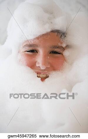 Portrait of a boy smiling in a bubble bath View Large Photo Image Stock Photography - Portrait of a boy smiling in a bubble bath. Fotosearch