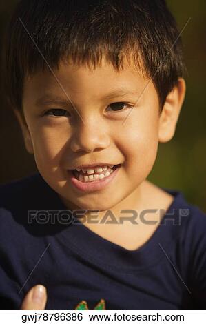 Portrait of a boy smiling View Large Photo Image Stock Photograph - Portrait of a boy smiling. Fotosearch