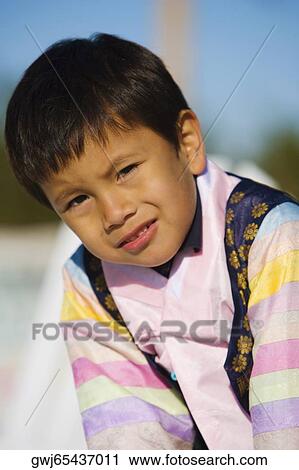 Stock Image - Portrait of a boy thinking. Fotosearch