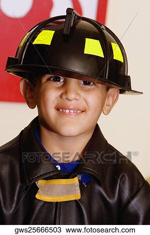 Portrait of a boy wearing a fireman costume View Large Photo Image Stock Image - Portrait of a boy wearing a fireman costume. Fotosearch