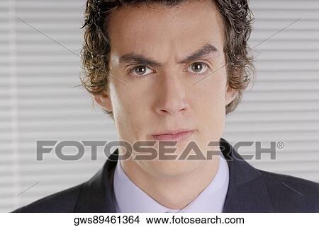 Portrait of a businessman looking serious View Large Photo Image Picture - Portrait of a businessman looking serious. Fotosearch