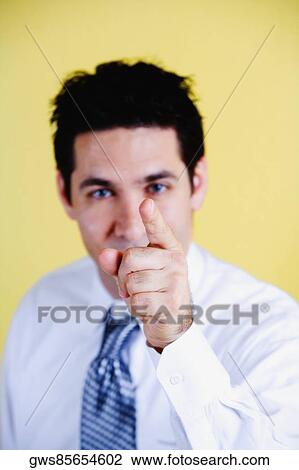 Portrait of a businessman pointing forward with his finger View Large Photo Image Stock Image - Portrait of a businessman pointing forward with his finger. Fotosearch