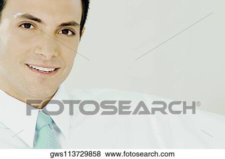 Portrait of a businessman smiling View Large Photo Image Stock Photo - Portrait of a businessman smiling. Fotosearch