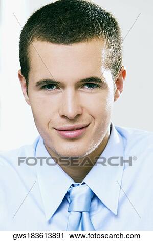 Portrait of a businessman smirking View Large Photo Image Stock Image - Portrait of a businessman smirking. Fotosearch