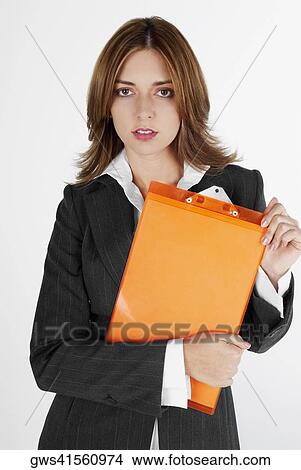 Portrait of a businesswoman holding a clipboard View Large Photo Image Picture - Portrait of a businesswoman holding a clipboard. Fotosearch