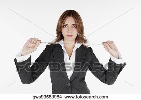 Portrait of a businesswoman holding a chain View Large Photo Image Picture - Portrait of a businesswoman holding a chain. Fotosearch