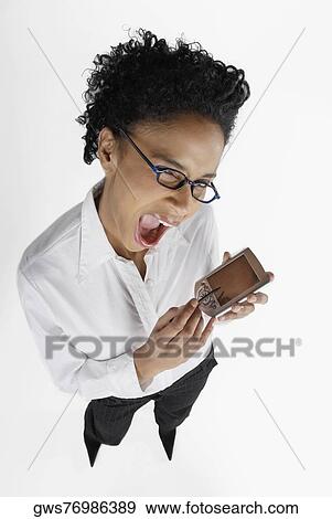 Portrait of a businesswoman operating a hand held device with a digitized pen View Large Photo Image Stock Photo - Portrait of a businesswoman operating a hand held device with a digitized pen. Fotosearch