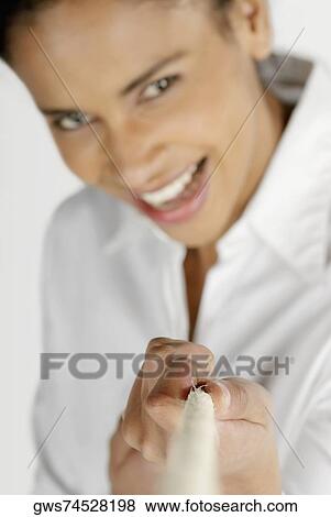 Portrait of a businesswoman pulling a rope and smiling View Large Photo Image Stock Photo - Portrait of a businesswoman pulling a rope and smiling. Fotosearch