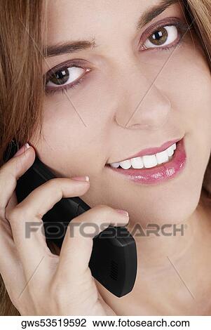 Portrait of a businesswoman talking on a mobile phone and smiling View Large Photo Image Stock Image - Portrait of a businesswoman talking on a mobile phone and smiling. Fotosearch