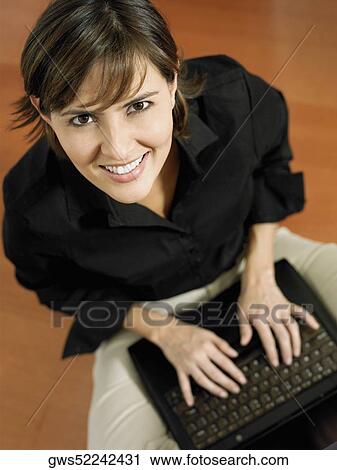 Portrait of a businesswoman using a laptop View Large Photo Image Stock Image - Portrait of a businesswoman using a laptop. Fotosearch